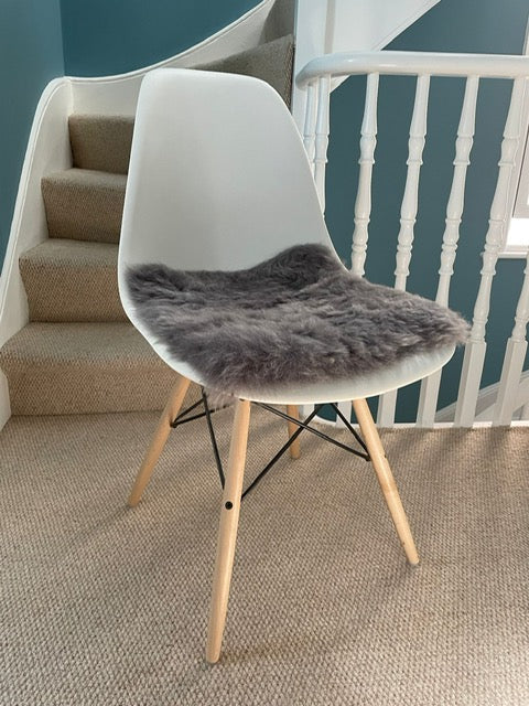 4 x Design Classic Eames side chairs in white moulded plastic with maple legs