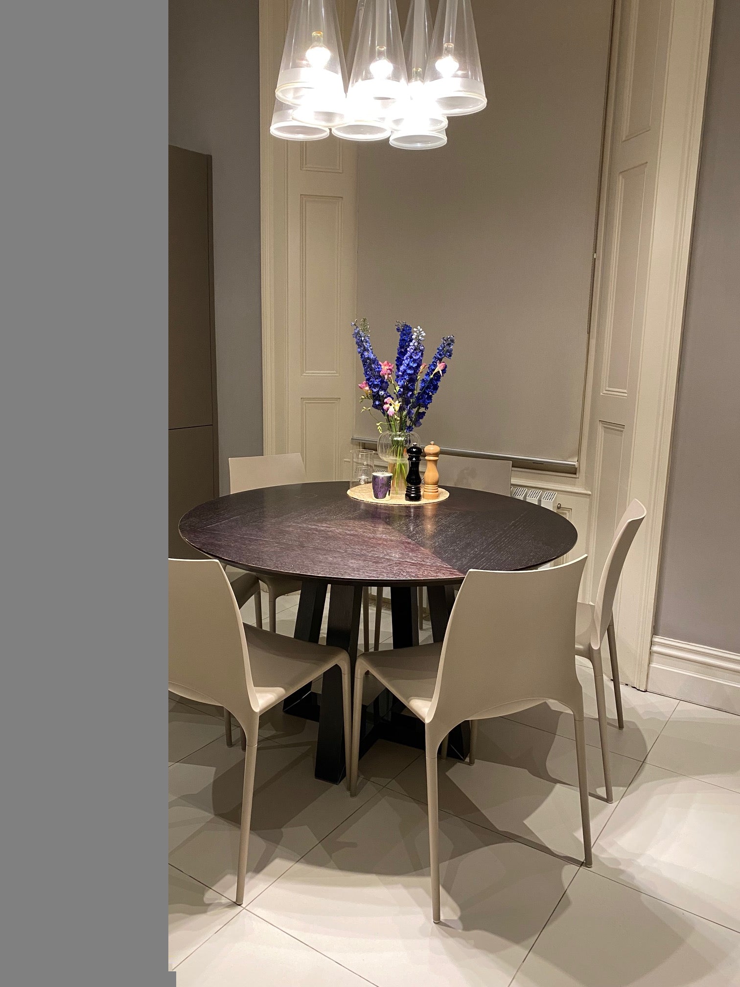 A round Dining table and chair set by Ligne Roset