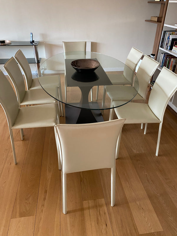 A Tom Faulkner "Capricorn" oval dining table & chair set