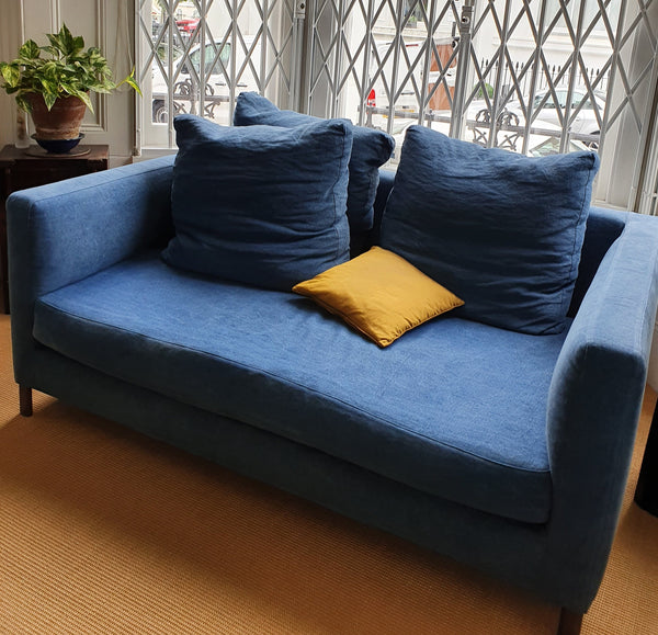 A pair of blue Verzelloni sofas