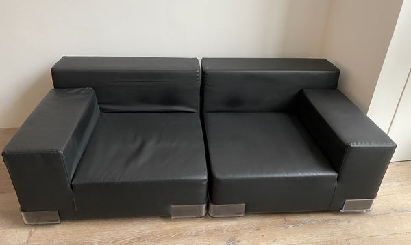 A Kartell by Piero Lissoni 'Plastics' sofa in black.