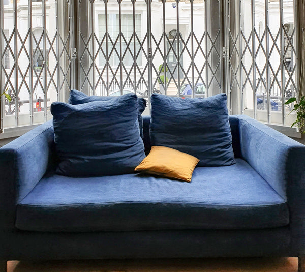 A pair of blue Verzelloni sofas